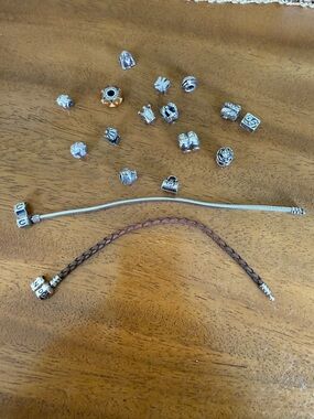 Pandora leather bracelet and Chamila Silver Charm Bracelet with charms